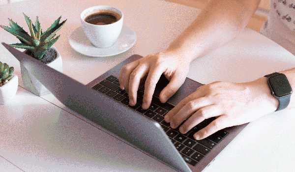 Person typing on a laptop